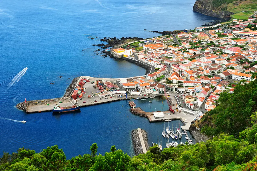 Aerial view of Sao Jorge Island showing the coastline, harbor, and town layout.